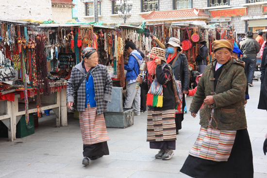 Pilgrims at the Barkhor near the Jokhang temple in Lhasa - Tibet-0960
